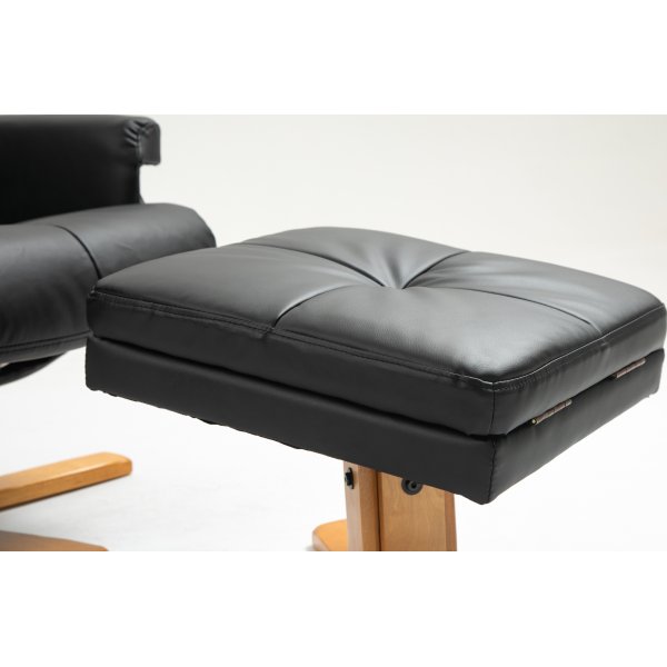 Duva Liegesessel mit Fuhocker aus schwarzem PU mit braunen Beinen